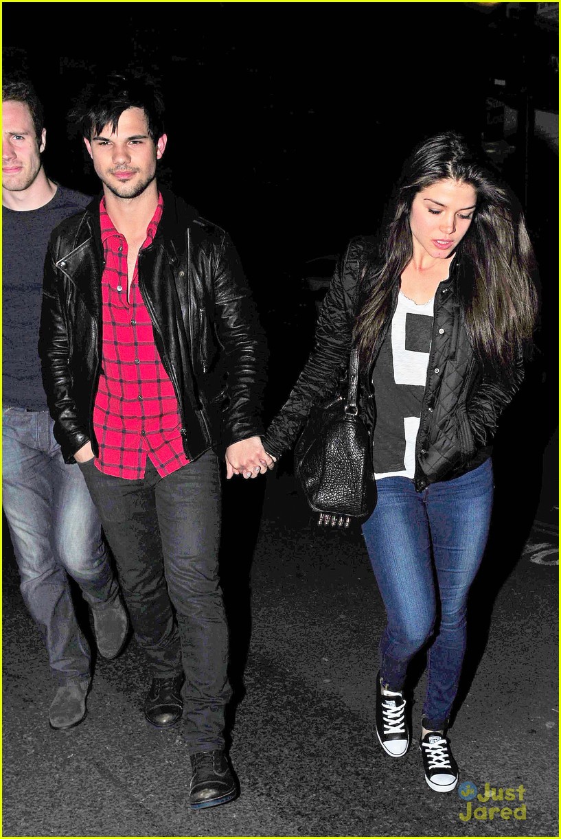 taylor lautner marie avgeropoulos matching jackets london 06
